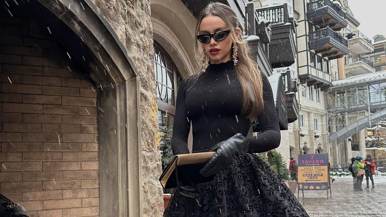 Black dress and sporty sunglasses