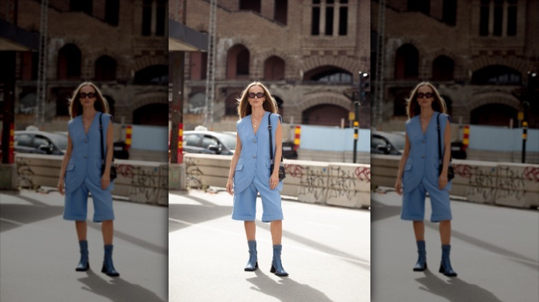 Woman wearing all pastel blue outfit