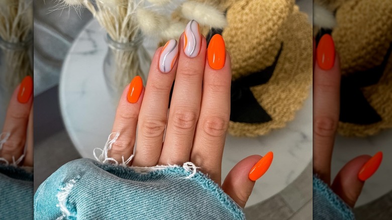 finger nails and jean jacket