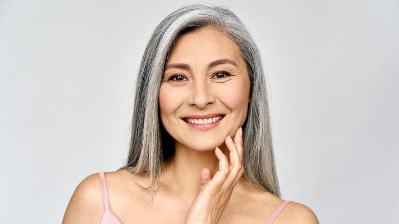 woman applying skincare