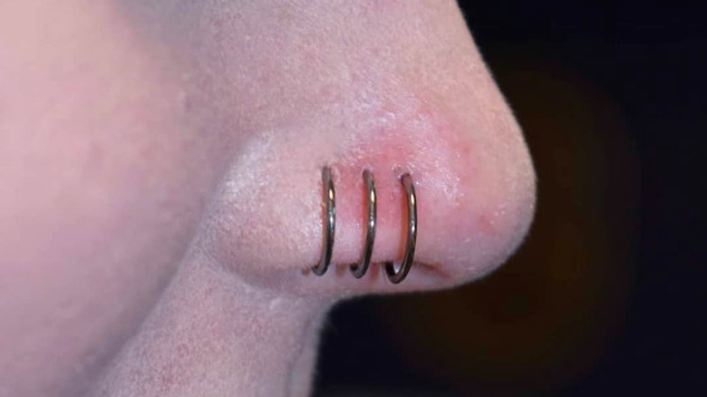 Three nose piercings