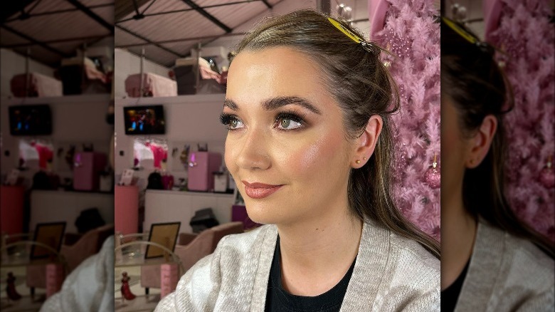 Woman models stained-glass makeup