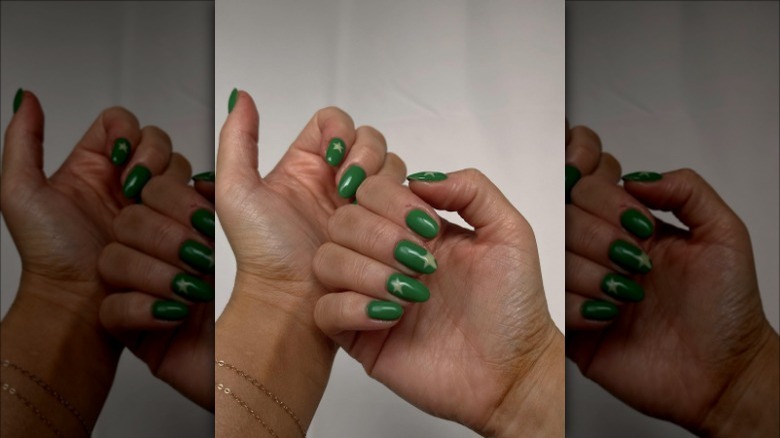 woman with green star nails