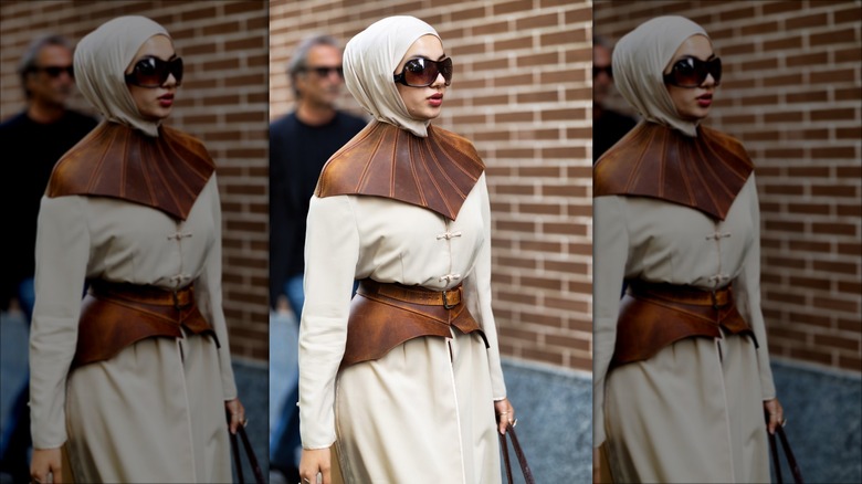woman wearing brown corset belt 