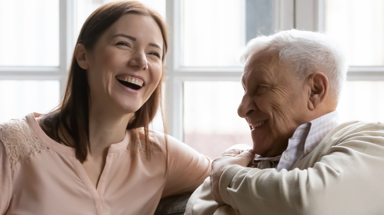 father and daughter laughing