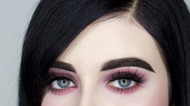 Dark red lips strong brows