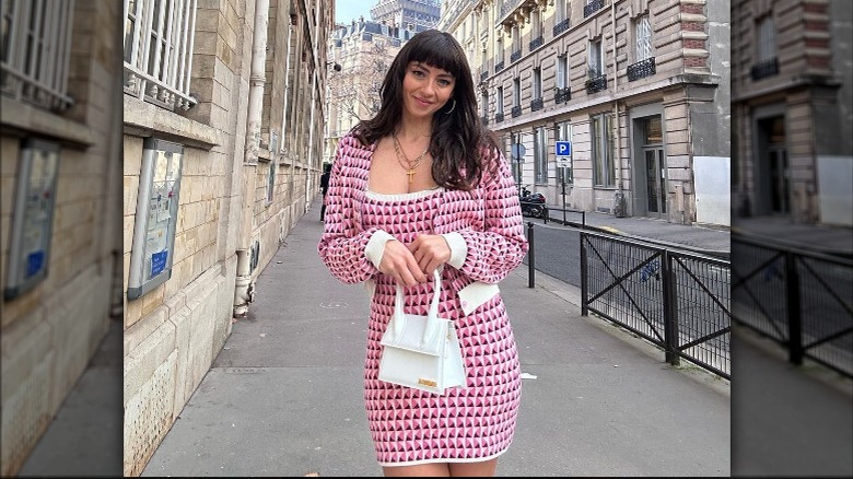 woman holding a structured handbag