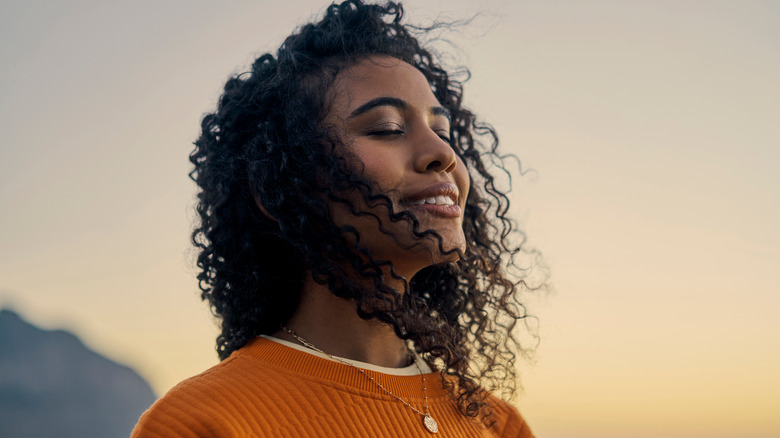 woman with eyes closed