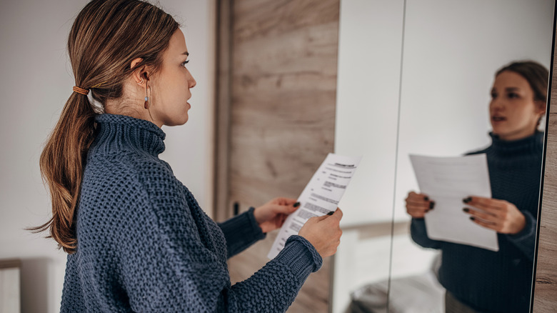 woman rehearsing speech into mirror