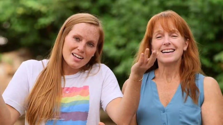 Mina Starsiak Hawk shrugging beside her mother