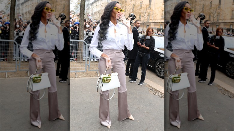 Winnie Harlow wearing a button-up shirt