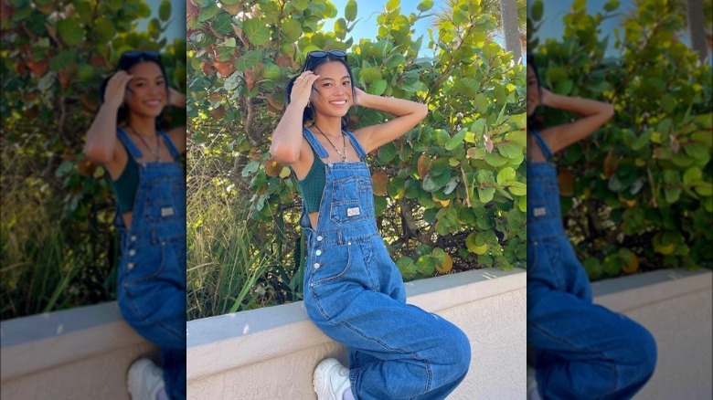 Woman wearing denim overalls