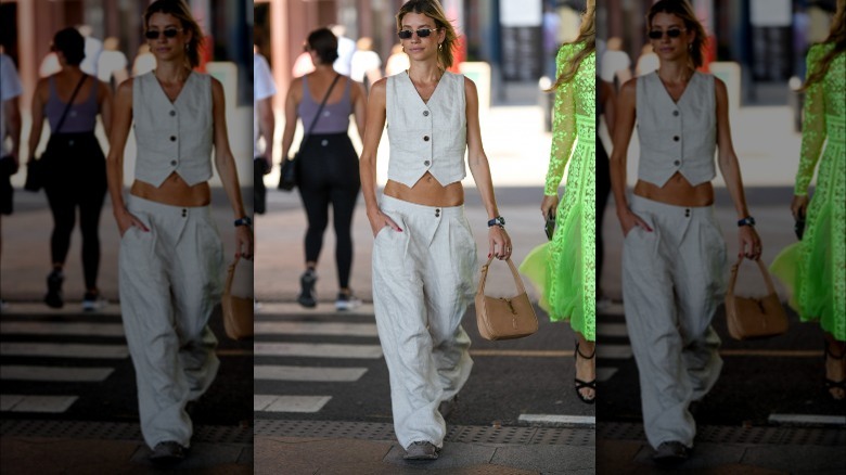 Woman wearing linen pants, vest