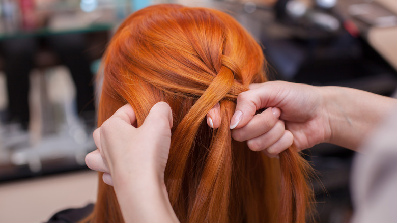 A woman getting her hair done