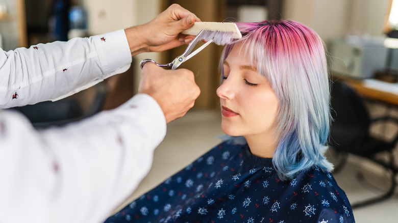 A woman getting her hair done