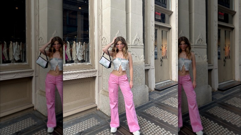 Girl wearing bright pink low-rise pants.