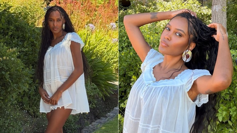 Ciara Miller posing with long braids in a white dress