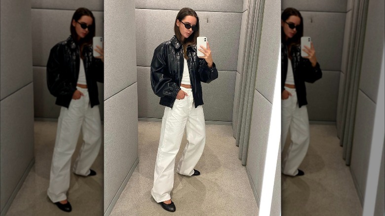 Woman wearing black ballet flats