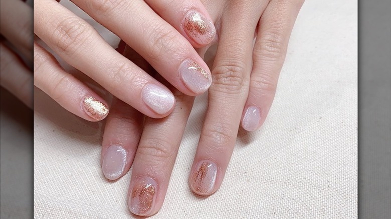 Hand with embellished velvet manicure