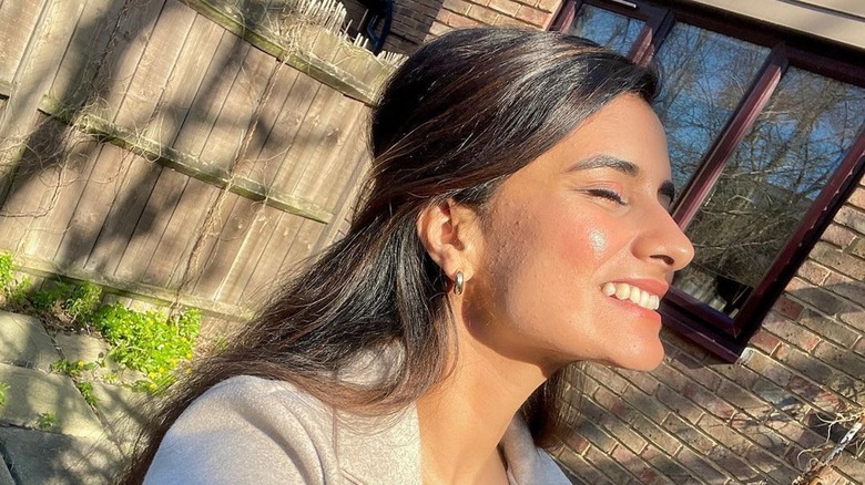 woman with glowing skin face to sky