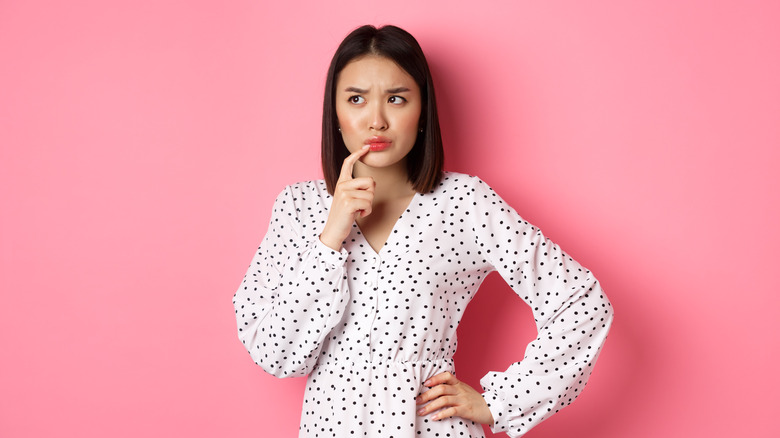 Asian woman thinking