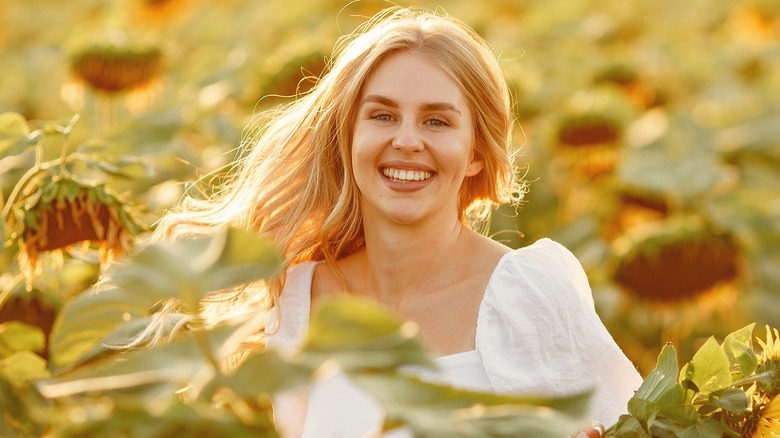 Woman with blond hair sunflowers