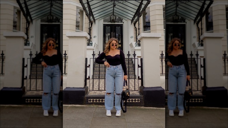 Woman wearing black sweetheart top