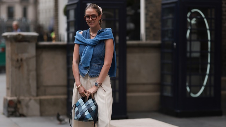woman wearing denim vest