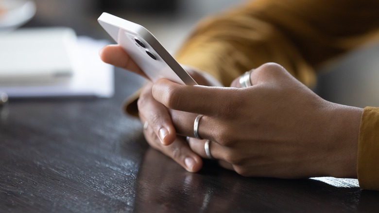 Close up of texting woman's hands 