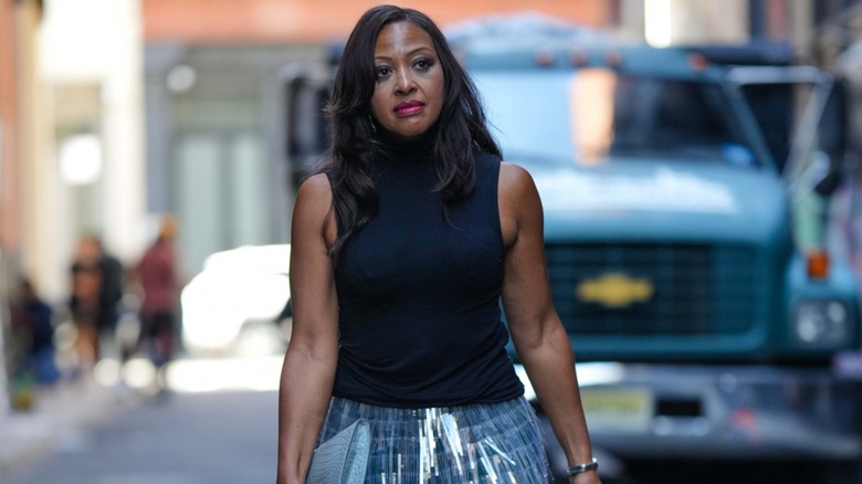 woman wearing sleeveless turtleneck