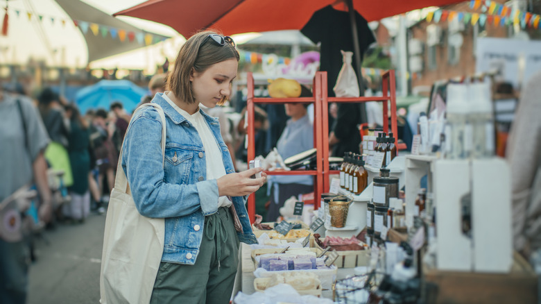 person shopping at soap stand