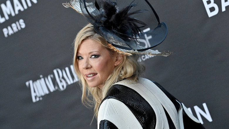 Tara Reid looking at the camera in a hat