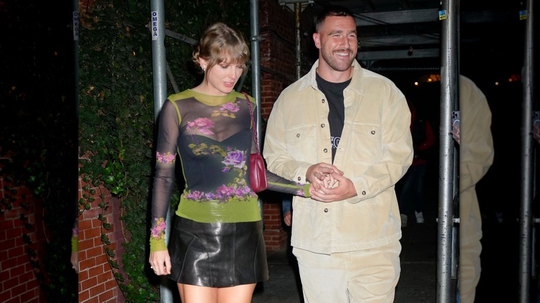 Taylor Swift sheer floral shirt black skirt