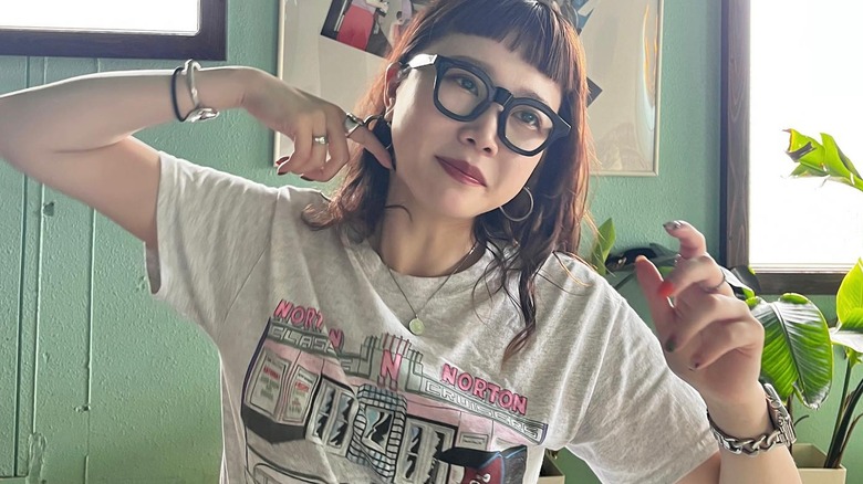 Woman wearing a chain Apple Watch band