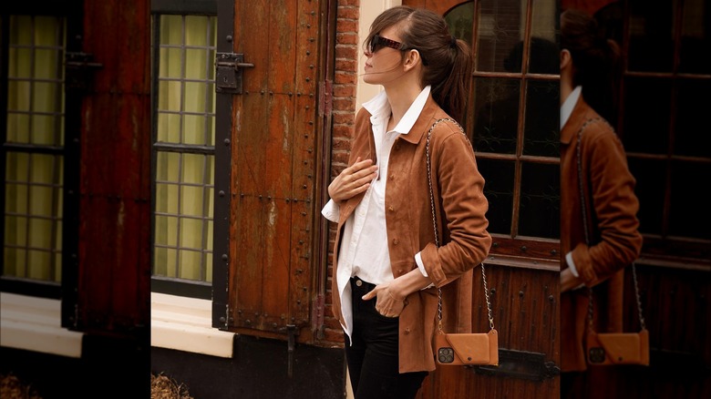 Woman wearing a phone purse