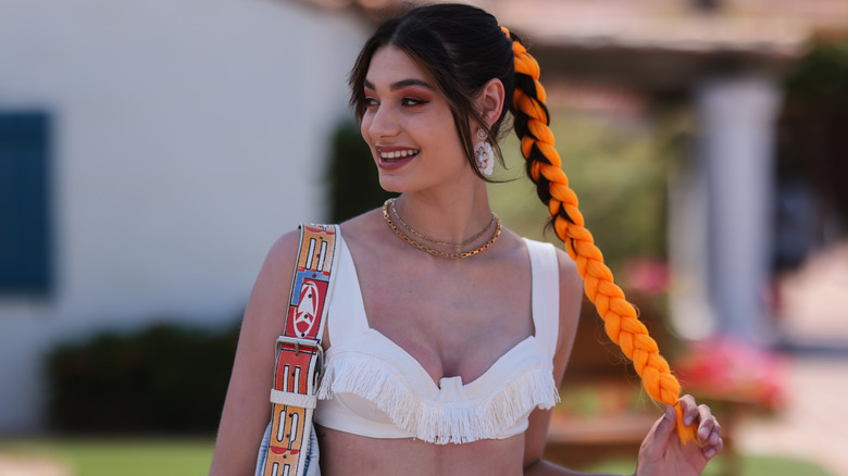 Sarah Posch orange braid ponytail