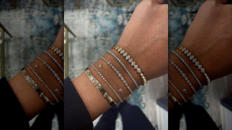 Woman wearing tennis bracelet stack