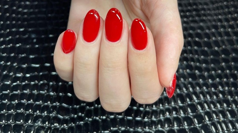 Bright apple-colored nails