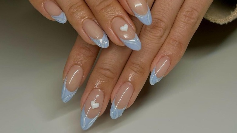 hands with blue French tips