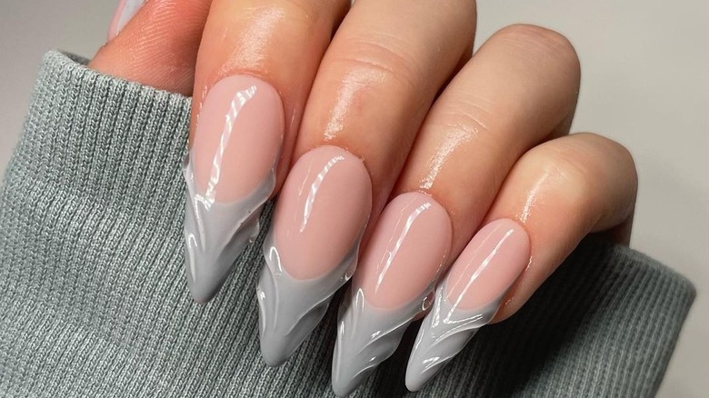 hands with gray 3D French tips