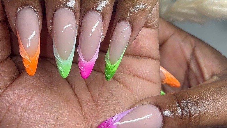 hands with multicolored 3D nails