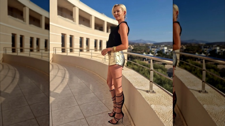 Woman wearing metallic shorts and gladiator heels