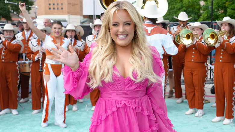 MaRynn Taylor smiling  and waving 