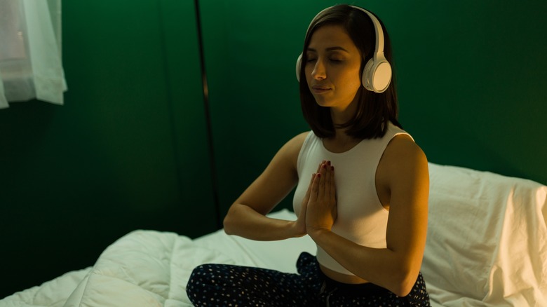Woman meditating before sleep