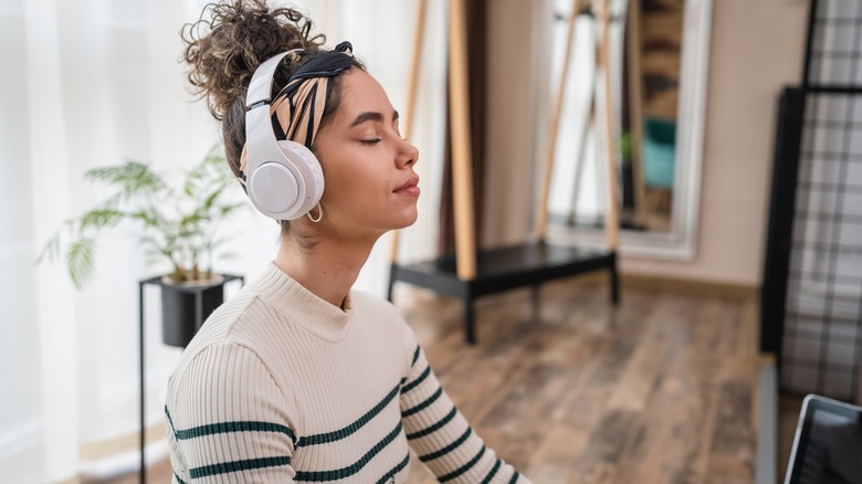 Woman breathing with headphones on