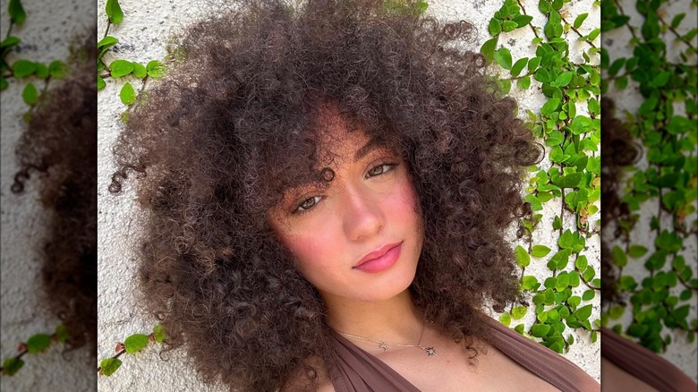 woman with fluffy curly bangs