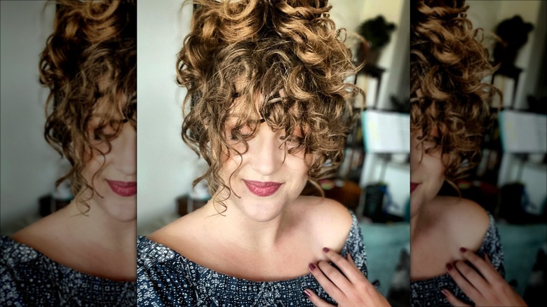 woman with mid-length curly bangs