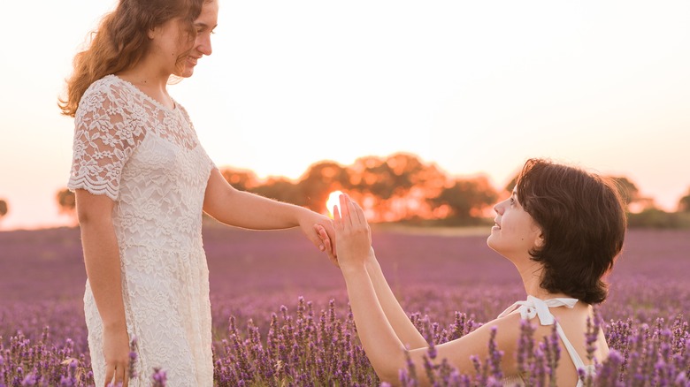 couple proposing outdoors