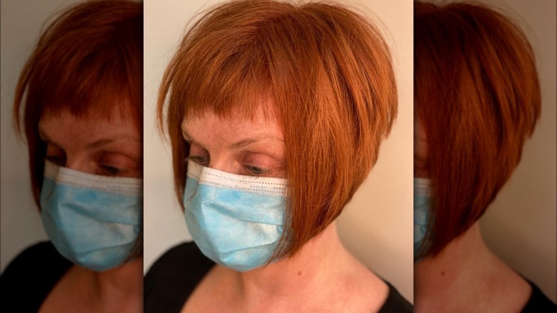 Woman with short bangs and a stacked bob