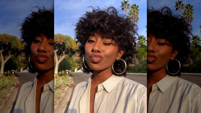 woman with curly chopped hair
